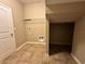 Spacious laundry room featuring tile floors, shelving and hookups at 4710 Nathan Hale Blvd, St Cloud, FL 34769