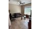 Inviting living room with tile flooring, a comfortable sofa, and a large window offering plenty of natural light at 4710 Nathan Hale Blvd, St Cloud, FL 34769