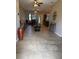 Open living area with neutral tile flooring, a dining area, and great natural light throughout at 4710 Nathan Hale Blvd, St Cloud, FL 34769