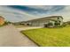 Residential street view of townhomes featuring attached garages and community landscaping at 4710 Nathan Hale Blvd, St Cloud, FL 34769