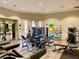 Well-equipped fitness center featuring modern exercise machines, weights, and fitness accessories in a spacious layout at 5012 Shoreway Loop # 205, Orlando, FL 32819