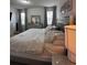 Comfortable bedroom boasts a king-size bed, neutral tones, and soft lighting, creating a relaxing atmosphere at 9083 Coral Cape St, Kissimmee, FL 34747