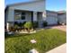 Lush landscaping and well-manicured lawn enhance this home's curb appeal at 9083 Coral Cape St, Kissimmee, FL 34747