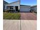 Beautiful single Gathering home with well maintained lawn, landscaping, and brick driveway at 9083 Coral Cape St, Kissimmee, FL 34747