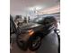 Spacious garage featuring an SUV with ample storage space and an automatic door opener at 9083 Coral Cape St, Kissimmee, FL 34747