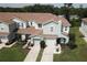 Aerial view showcasing the townhome's landscaping, driveways, and convenient access to nearby amenities at , Kissimmee, FL 34744