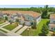 Aerial view of townhomes showing lawns, driveways and common parking areas at , Kissimmee, FL 34744