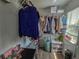 Walk-in closet with shelving, drawers and hanging clothes at , Kissimmee, FL 34744