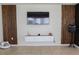 Modern living room with stylish accent walls, floating shelves, and a sleek entertainment center at , Kissimmee, FL 34744