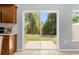 View of outdoor patio through sliding glass doors and the nearby garden at , Kissimmee, FL 34744