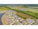 Gorgeous aerial view showcasing a residential community with lush greenery, lakes, and manicured lawns at 109 Pineywoods St, St Cloud, FL 34772
