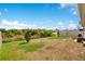Expansive backyard features lush greenery and ample space for outdoor activities at 109 Pineywoods St, St Cloud, FL 34772