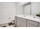 Bright bathroom with white vanity, quartz countertop, a shower with curtain, and neutral accents at 109 Pineywoods St, St Cloud, FL 34772