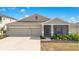 Charming single-Gathering home with a large driveway, screened porch, and well-maintained landscaping at 109 Pineywoods St, St Cloud, FL 34772