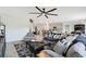 Spacious living room with an open floor plan, stylish seating, and clear view of the kitchen at 109 Pineywoods St, St Cloud, FL 34772