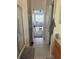 Bathroom featuring tiled floors, a glass shower, and access to an adjoining room at 2991 Saint Clair St, Kissimmee, FL 34746