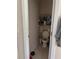 Hall bathroom featuring a toilet and storage shelves at 2991 Saint Clair St, Kissimmee, FL 34746