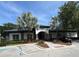 Community clubhouse exterior with palm trees, landscaping, and parking area at 2991 Saint Clair St, Kissimmee, FL 34746