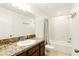 Bathroom featuring a single vanity with granite counters and a tub-shower combination at 3341 Rodrick Cir, Orlando, FL 32824
