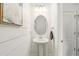Charming powder room with shiplap accent wall and a stylish pedestal sink at 3341 Rodrick Cir, Orlando, FL 32824