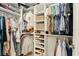 Organized walk-in closet with built-in shelving, providing ample storage space for clothes and accessories at 3341 Rodrick Cir, Orlando, FL 32824