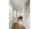 Bright hallway with hardwood floors, white walls, and staircase leading to the upper level at 3341 Rodrick Cir, Orlando, FL 32824