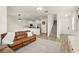 Open floor plan with living area and kitchen, hard surface floors, and stairs to the second floor at 3341 Rodrick Cir, Orlando, FL 32824