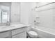 Bright bathroom with tub and shower, a toilet, and a sink and vanity at 1743 Carnelian St, Deland, FL 32720