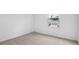 Bright bedroom featuring a window with a view of a neighboring house at 1743 Carnelian St, Deland, FL 32720