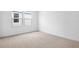 Well-lit bedroom showcasing two windows that provide plenty of natural light at 1743 Carnelian St, Deland, FL 32720