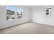 Bright bedroom showcasing two large windows offering views of the neighborhood at 1743 Carnelian St, Deland, FL 32720