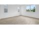 Bright, airy bedroom featuring neutral walls and wood-look floors with ample natural light at 1743 Carnelian St, Deland, FL 32720