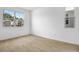 Bright bedroom with wood-look floors, ample natural light and neutral paint at 1743 Carnelian St, Deland, FL 32720