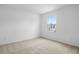 A cozy bedroom featuring two windows offering a view of the neighborhood at 1743 Carnelian St, Deland, FL 32720
