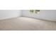 A bright bedroom featuring large windows with a view of palm trees and the neighborhood at 1743 Carnelian St, Deland, FL 32720