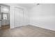 Bright bedroom featuring a double-door closet and neutral carpet flooring at 1743 Carnelian St, Deland, FL 32720