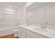 Well-lit bathroom featuring double sinks, wood-look flooring, and a shower at 1745 Carnelian St, Deland, FL 32720