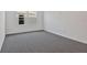 Bright bedroom featuring a carpet floor and window with a view at 1745 Carnelian St, Deland, FL 32720