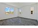 Bright bedroom featuring tile floors and large windows with a view of the neighborhood at 1745 Carnelian St, Deland, FL 32720