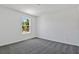 Cozy bedroom with carpet floor and a window bringing in natural light at 1745 Carnelian St, Deland, FL 32720