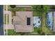 Aerial view of a lovely home featuring a large backyard with a screened pool and solar panels at 3852 Brantley Place Cir, Apopka, FL 32703