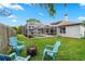 Spacious backyard with a screened pool, fire pit and seating, perfect for entertaining at 3852 Brantley Place Cir, Apopka, FL 32703