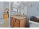 Bathroom features granite counters, light wood cabinetry and decorative wall art at 3852 Brantley Place Cir, Apopka, FL 32703