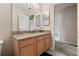 Well-lit bathroom featuring a granite countertop, wooden cabinetry, and neutral wall paint at 3852 Brantley Place Cir, Apopka, FL 32703