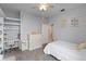 Bedroom with carpet, ceiling fan, white dresser, open storage and whimsical decorations at 3852 Brantley Place Cir, Apopka, FL 32703