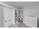 Cozy bedroom featuring built-in shelving, drawers, a desk, and carpeted floors at 3852 Brantley Place Cir, Apopka, FL 32703
