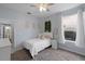 Charming bedroom with a twin bed, white bedding, and a bright window, creating a cozy and inviting space at 3852 Brantley Place Cir, Apopka, FL 32703