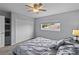 Light-filled bedroom with a ceiling fan, neutral-toned carpet, and a double-door closet at 3852 Brantley Place Cir, Apopka, FL 32703