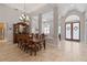 Formal dining room showcasing tile floors, statement chandelier, and sophisticated furniture at 3852 Brantley Place Cir, Apopka, FL 32703