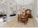 Open dining area with decorative chandelier and coffered ceilings at 3852 Brantley Place Cir, Apopka, FL 32703